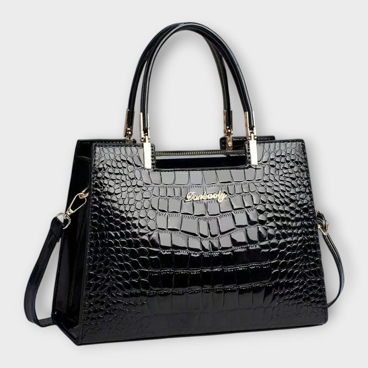 Cécile. - Bolsa de mão em padrão de pele de crocodilo brilhante