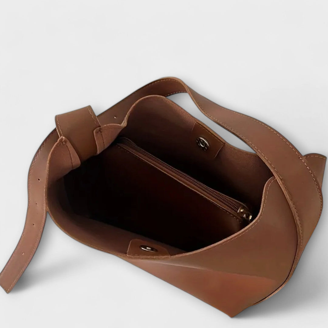 Cécile. – Elegante mala de ombro em couro